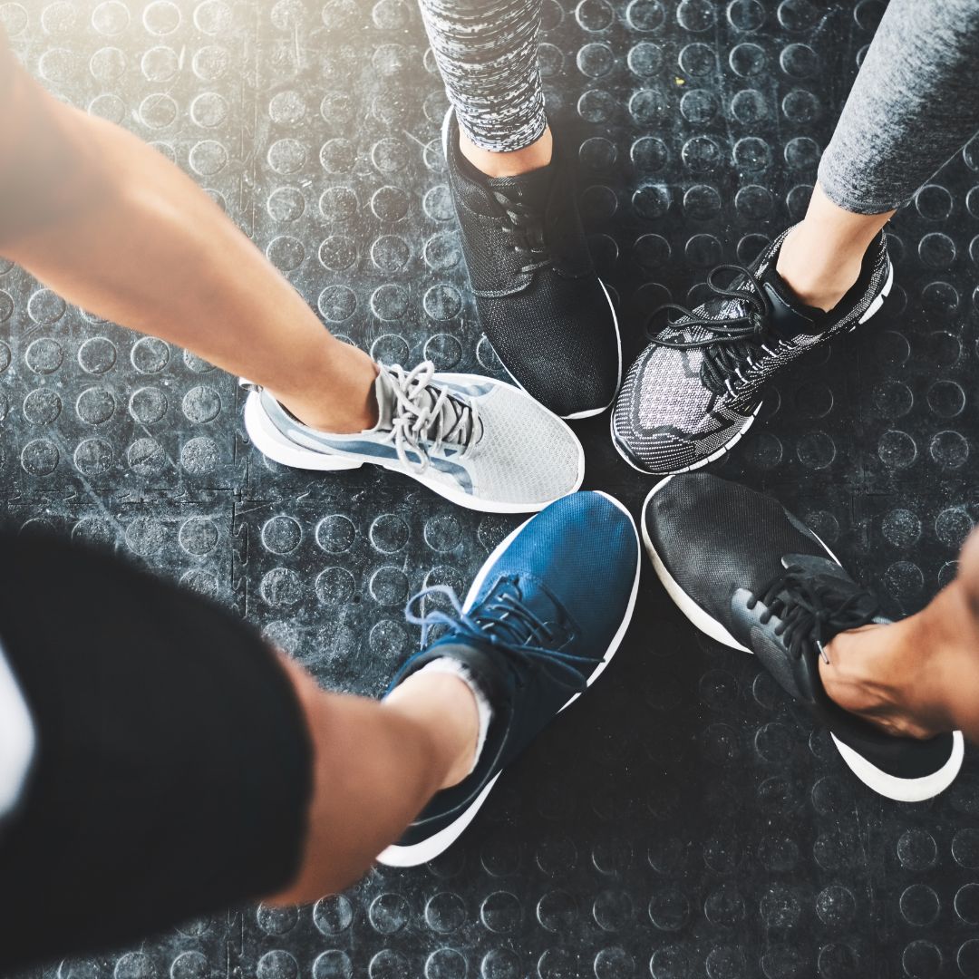 picture of peoples shoes touching toes in the middle like a star