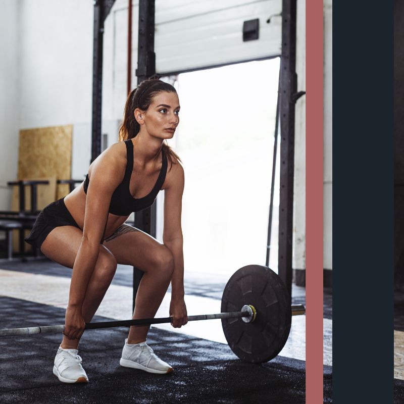 woman lifting weight on home gym rubber floor