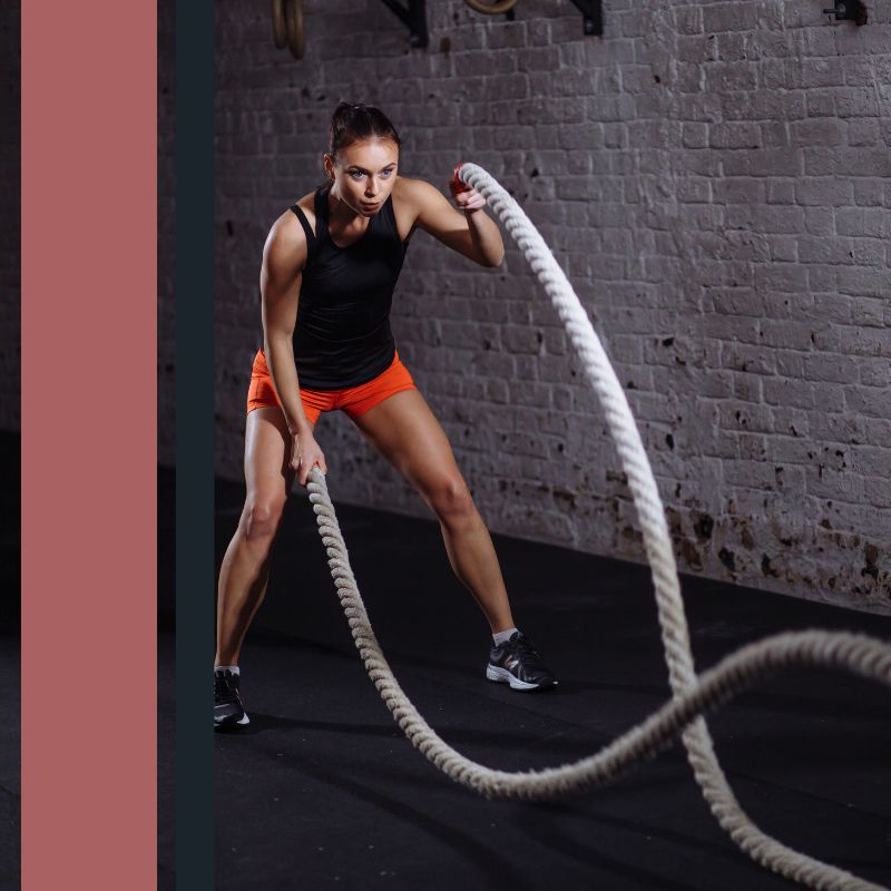 woman using workout ropes